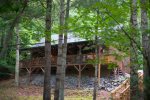 The cabin is in a forested location close to Boone, NC